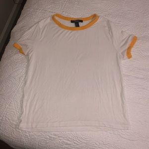 White T with yellow detailing